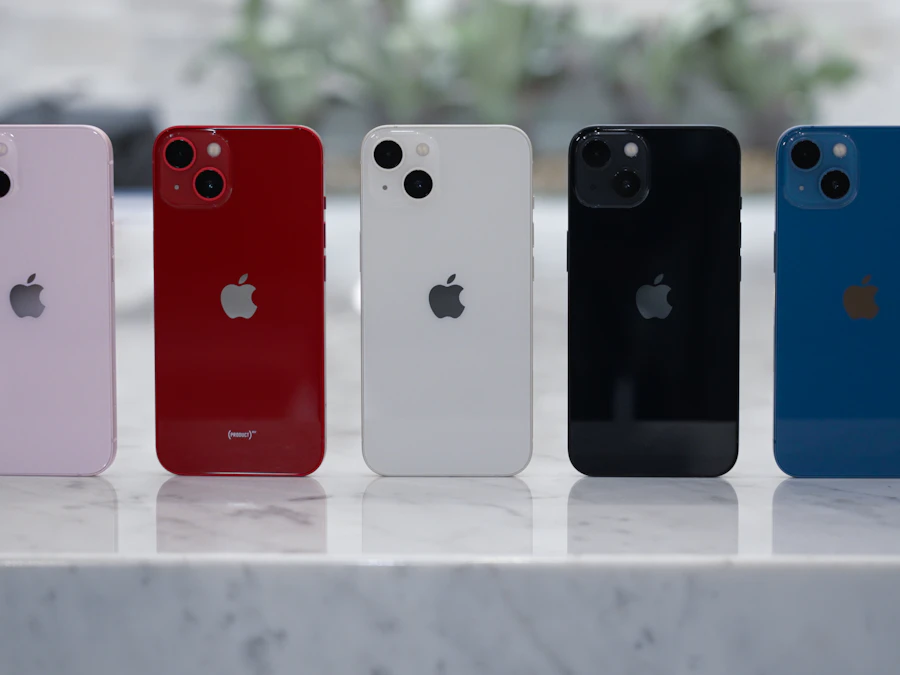A row of iPhones in five colours